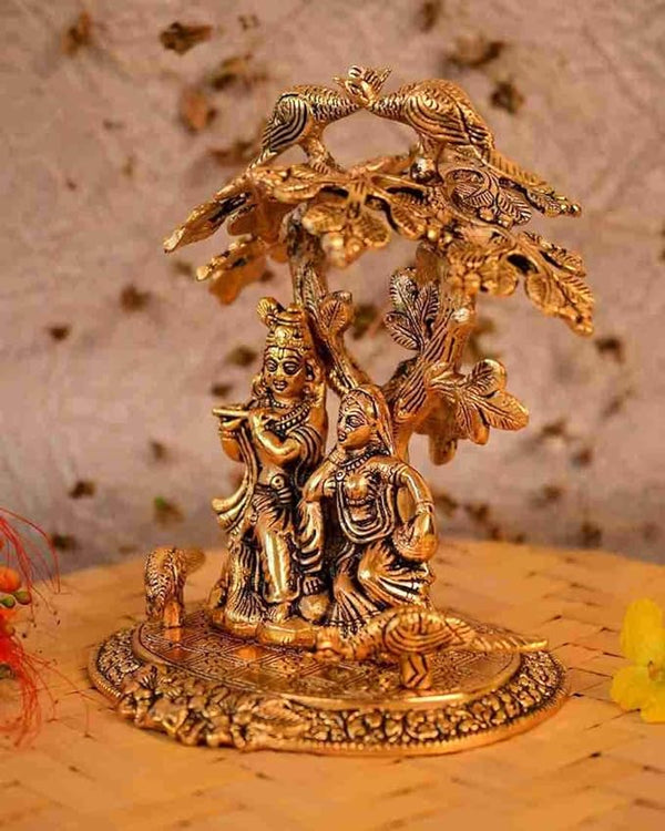 Golden Metal Radha Krishna Sitting Under Tree Idol | Radha Krishna Statue Showpiece for Gift Temple Puja Room Home Decor Height 24 Cm Study Setting