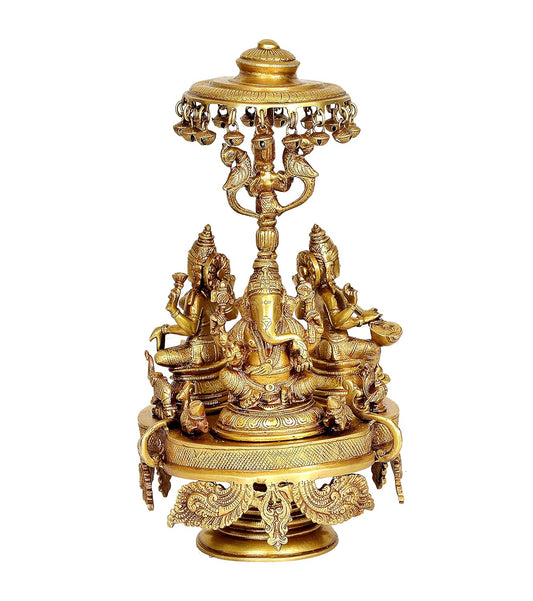 Brass Lakshmi, Ganesha and Saraswati Seated on Rotating Chowki with Parasol Idol (Height: 14 Inch)
