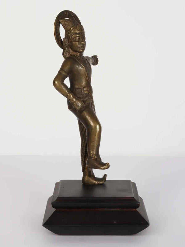 Brass Statue of Lord Krishna Standing on a Wooden Pedestal 8 inches Entryway Setting