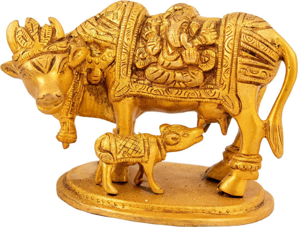 Mother cow nursing her calf with Lakshmi and Ganesha carved on either side of her robe 3 inches Entryway Setting