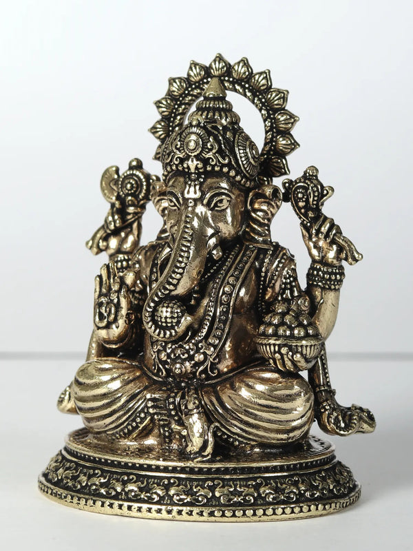 Small Brass Statue of Lord Ganesha with Four Arms Holding Laddu 6 CM Entryway Setting