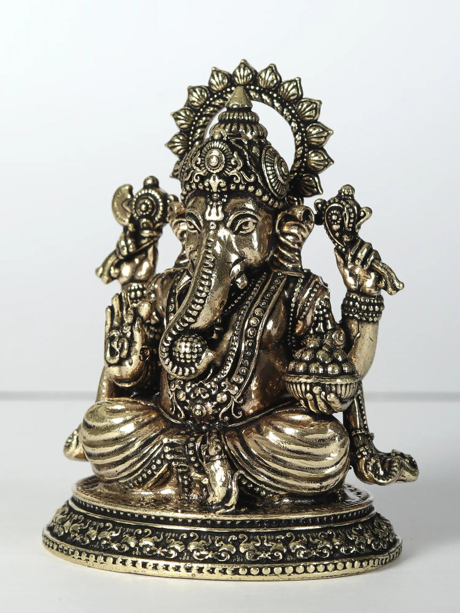 Small Brass Statue of Lord Ganesha with Four Arms Holding Laddu 6 CM Craft Detail