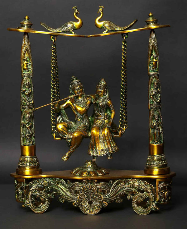 Greenish Gold Brass Statue of Radha Krishna on a Peacock Swing 18 Inches Mandir Setting