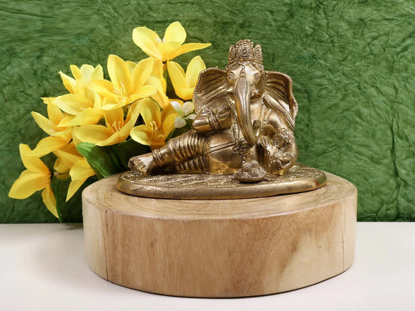 Brass Idol of Lord Ganesha Enjoying Modak 6 inches Mandir Setting