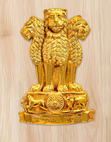 Golden metal lion wall hanging with Ashoka chakra emblem on the base