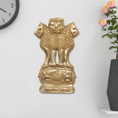 Brass Ashoka Stambh wall hanging, lion-faced idol figure with detailed base