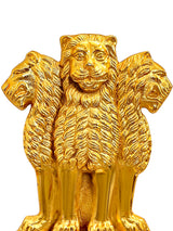 Golden metal lion wall hanging, close view of face, mane, and ears