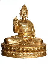 Brass Buddha statue, seated on ornate round base with detailed robe pattern