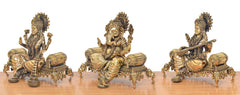 Lakshmi-Ganesha-Saraswati idol trio, side view of three seated figures on detailed bases