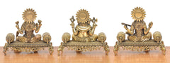 Lakshmi-Ganesha-Saraswati idol trio, back view with decorative halos and seated bases