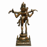 Dancing Shiva Nataraja brass statue, gold-green finish, rear 3/4 view with raised arms
