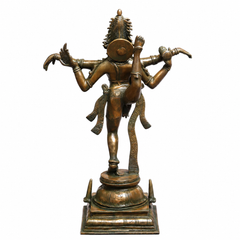 Dancing Shiva Nataraja brass statue, gold-green finish, rear 3/4 view with raised arms