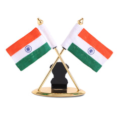 Reverse of brass Indian flag ornament with crossed tricolour flags and dark emblem backing