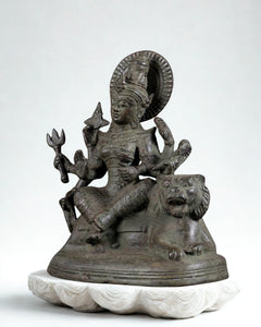 Bronze goddess Durga seated with arms raised on lion base, 7 in