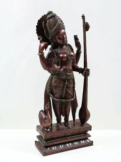 Brass Saraswati figurine standing with veena staff, side view and engraved base