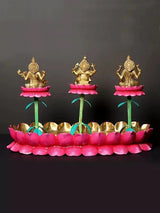 Brass Lakshmi, Ganesha, Saraswati on separate pink lotus stands with golden base