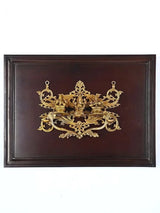 Brass Lakshmi, Ganesha, Saraswati wall hanging in wooden frame, ornate centerpiece