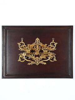 Brass Lakshmi, Ganesha, Saraswati wall hanging in wooden frame, ornate centerpiece
