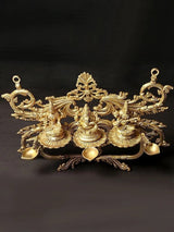 Brass dipam wall hanging with Lakshmi and two seated deity lamp holders