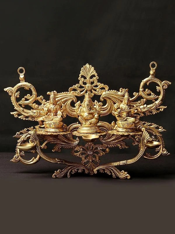 Brass Lakshmi, Ganesha, and Saraswati Wall Hanging with Dipam (Height: 14 Inch)