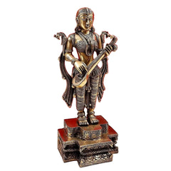 Brass Saraswati deity figurine, standing pose holding veena and ornate base