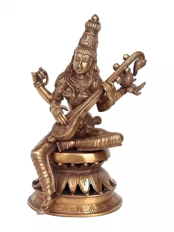 Handmade brass Saraswati statue playing the veena, seated on lotus base