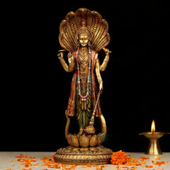 Standing Vishnu resin idol with painted maroon-green robe and gold detailing