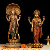 Standing Vishnu & Lakshmi resin idol, gold finish with painted garments