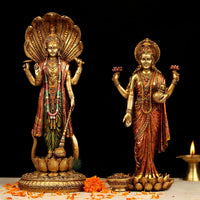Standing Vishnu & Lakshmi resin idol, gold finish with painted garments