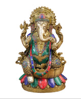 Brass Ganapathy statue seated on lotus pedestal, painted jeweled details, hands raised