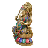 Brass Ganapathy seated figure with colorful jeweled attire, side view