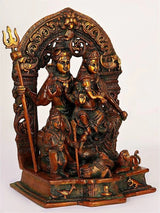 Antique red brass Shiva Parivar idol with raised trident, four figures and ornate arch
