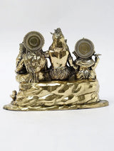 Brass Shiva family statue rear view, circular halo ornaments and seated figures