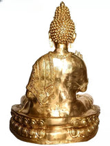Back view of large brass Buddha sculpture on engraved round pedestal base