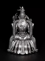Back view of 4-inch Rajarajeshwari goddess statue with arched crown and layered dress