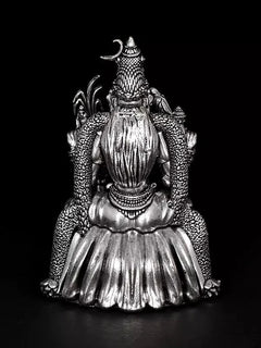 Back view of 4-inch Rajarajeshwari goddess statue with arched crown and layered dress