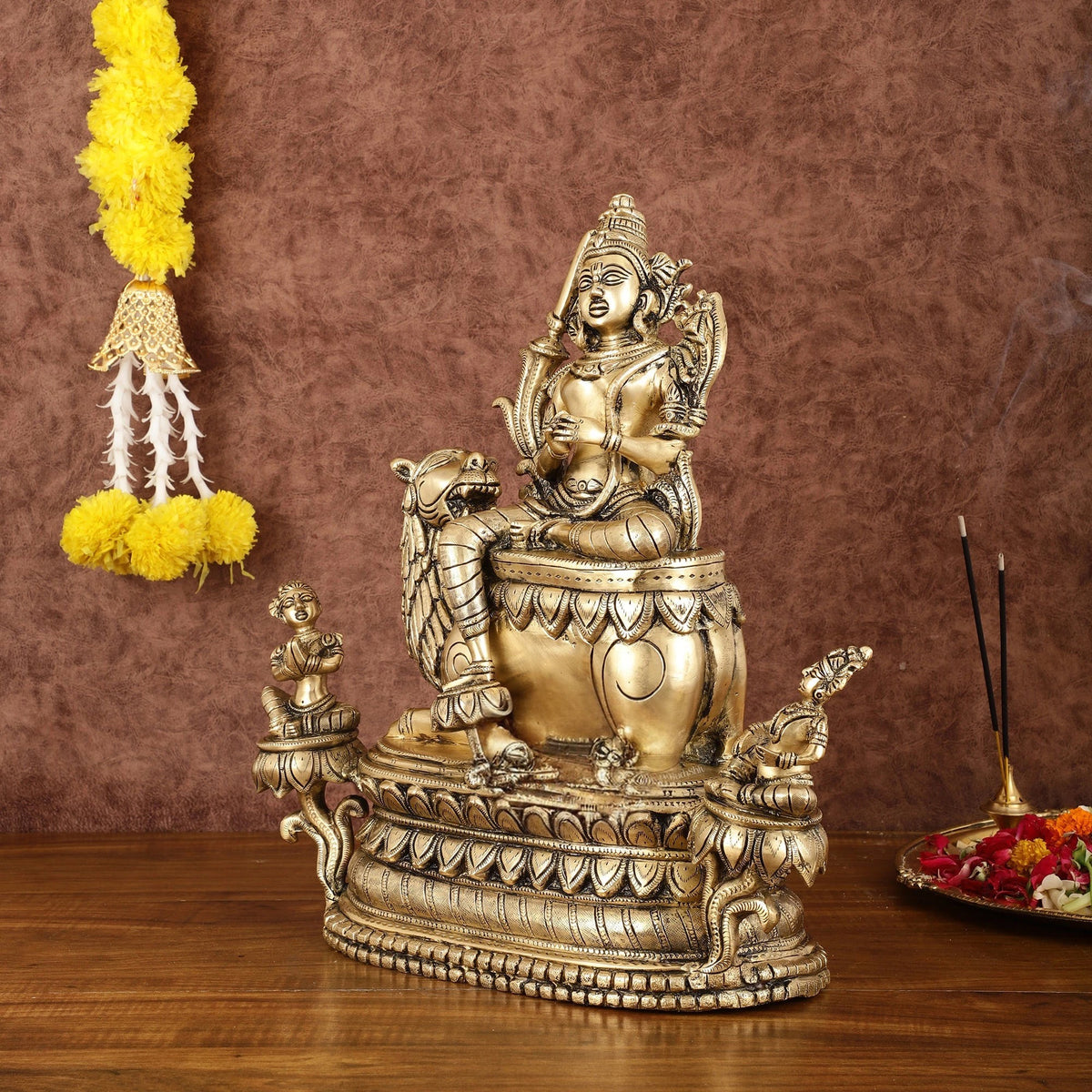 Brass Tara Devi statue seated on ornate lion idol, 16 in height