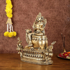 Brass Tara Devi statue seated on ornate lion idol, 16 in height