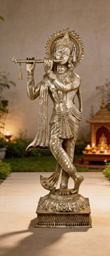 Brass Lord Murli Krishna idol with long flowing scarf, raised hand and flute, on ornate base