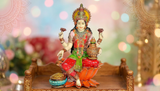 Lakshmi idol for Diwali pooja, seated on orange lotus with pot and diyas, 7.5 in