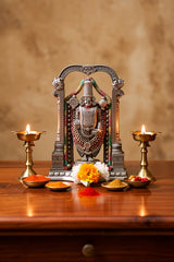 Lord Venkateswara Balaji idol in antique bronze with beaded arch and colorful garlands
