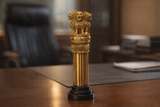 Brass Ashok Chakra pillar showpiece 6 in, lion top on ribbed column, black base