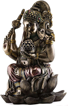 Gold-tone Ganesha resin statue with jeweled headpiece, trunk, raised hands, seated on lotus