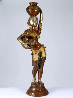 Brass lady statue carrying milk pot and holding bowl, detailed gold ornaments