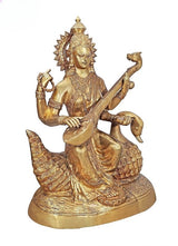 Brass Saraswati idol seated on swan, veena in hands, detailed beaded ornaments