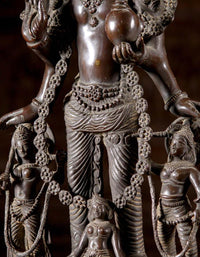 Brass Vaikuntha Vishnu statue close-up: detailed torso, draped lower garment, 26 in