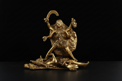 Brass Kali Maa idol with detailed face, flowing attire, and arms raised