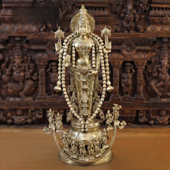 Brass Vishnu idol, tall standing figure with ornate crown, garlands, multi-arm