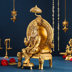 Brass Maharaja Agrasen idol, side view on carved lion-supported throne
