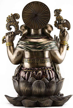 Back view of gold-tone Ganesha resin statue with circular halo disk and lotus base